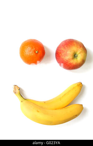 Fruits imitating a smiling face. Isolated on white Stock Photo