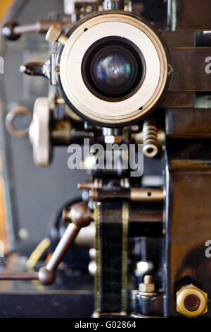 A vintage reel to reel film movie projector shot in a home setting