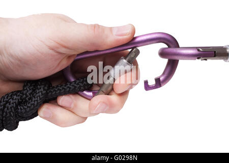 Carabine and climbing rope in knot. Climbing equipment Stock Photo