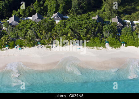 The Banyan Tree Hotel on the beach Anse Intendance Stock Photo