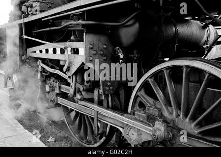 Close up of the wheels and suspension of the old steam engine Stock Photo