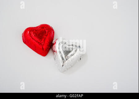 Two Foil Wrapped Heart Shaped Candies Stock Photo