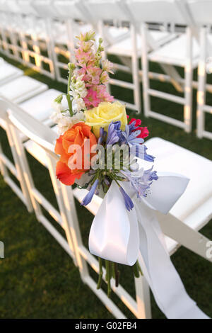 Floral Decor on White Chair Stock Photo