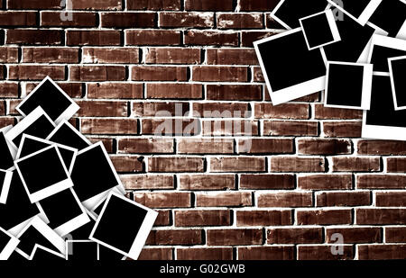 Empty instant photos on grunge brick wall backgrou Stock Photo