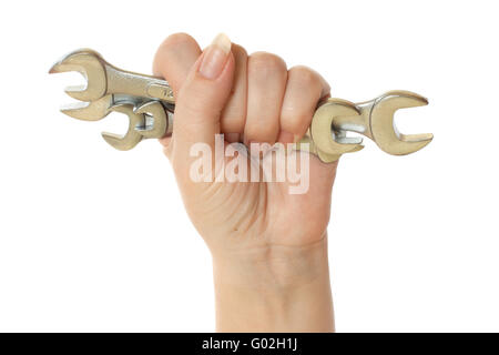 female hand holding wrench tools isolated on white background Stock Photo