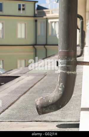 Copper rusty roof gutter from a top of an house Stock Photo