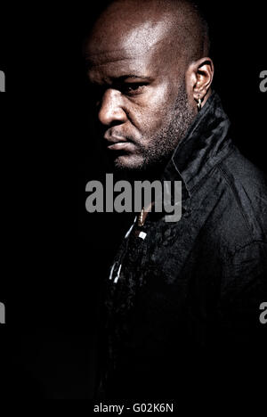 Black gangster men looking serious high contrast low key. Stock Photo