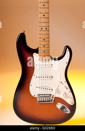 Electric guitar detail with multicolour lighting. Stock Photo