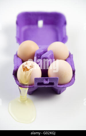 four eggs in a carton Stock Photo