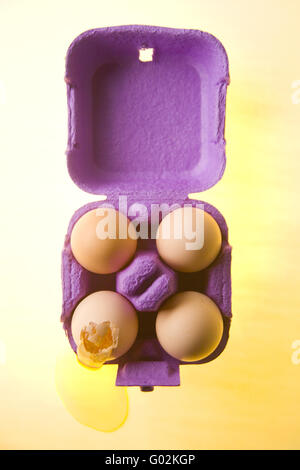four eggs in a carton Stock Photo