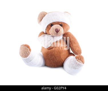 Sick teddy bear wrapped in bandages Stock Photo