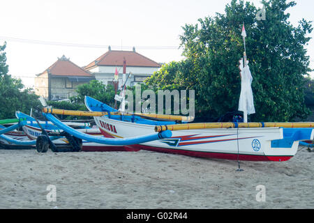 Jukungs or traditional fishing Boats in Jimbaran Bay, Bali. Stock Photo