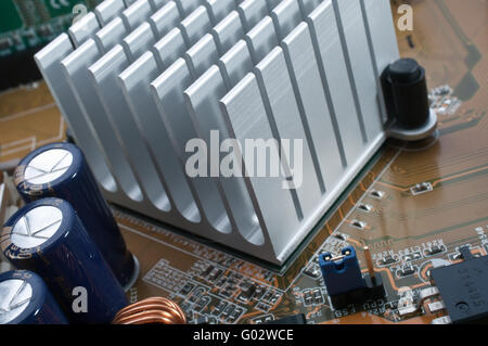 extreme close-up of aluminum radiator installing on motherboard chipset Stock Photo
