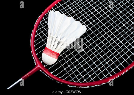 Badminton racket and shuttlecock isolated on a black background Stock Photo