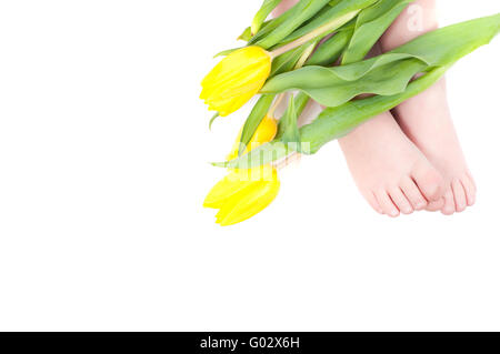 Studio shot of little girl foots with flowers Stock Photo