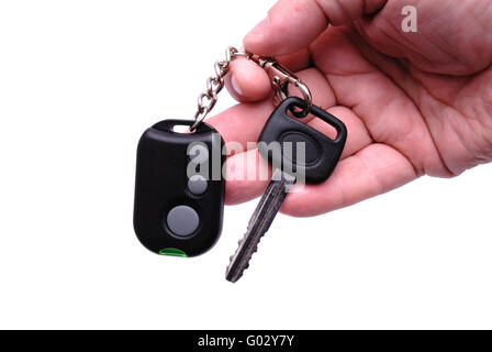 Automobile keys and remote control panel from the car alarm system in a hand. Stock Photo