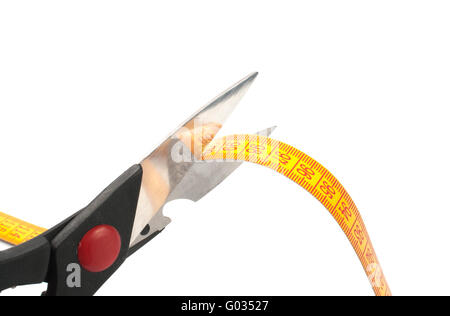 scissors cutting a measuring  on white background Stock Photo