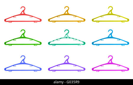 Plastic hangers of various colours over white back Stock Photo