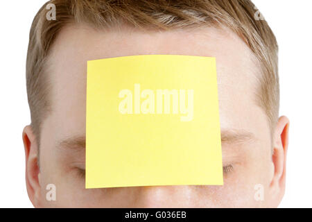 Man with a blank adhesive note on the forehead Stock Photo