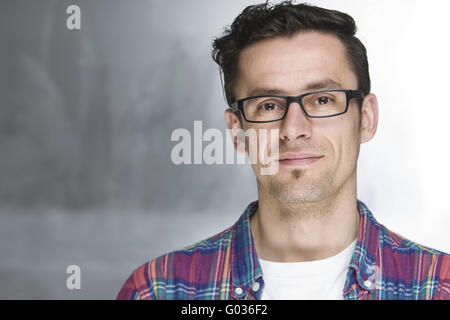 young handsome guy with glasses smiling Stock Photo