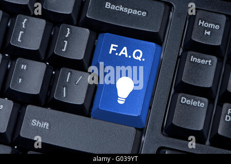 F.A.Q. blue button computer keyboard internet concept. Stock Photo
