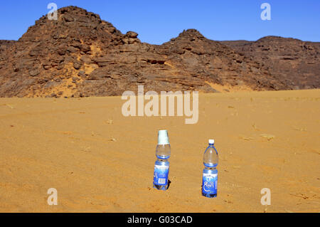 bottles of mineral water in the desert Stock Photo