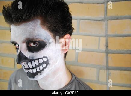 portrait of a creepy skeleton guy perfect for Carnival (brick wall background) Stock Photo