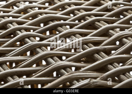 brown wicker structure ahead of a white background Stock Photo