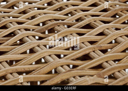 brown wicker structure ahead of a white background Stock Photo