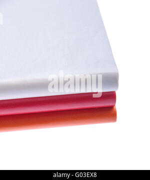 pile of colored notebooks (isolated on white background) Stock Photo