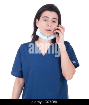 busy female doctor in uniform talking on the phone (isolated on white background) Stock Photo