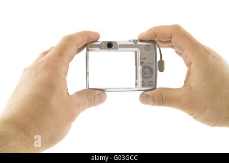 The digital camera in a hands isolated over white background Stock Photo