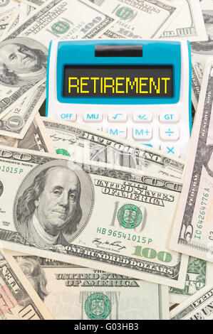 Retirement word on calulator with American notes Stock Photo