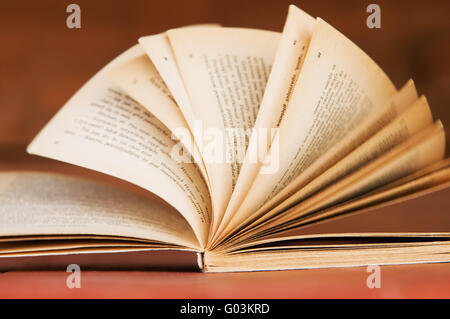 Open book in retro style on wooden background. Education concepts Stock Photo