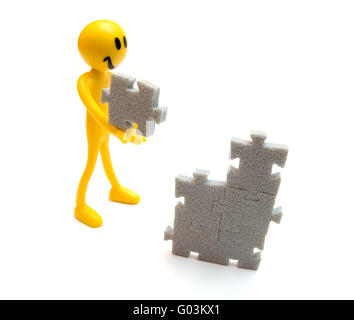 Putting pieces of puzzles together. Conceptual image Stock Photo