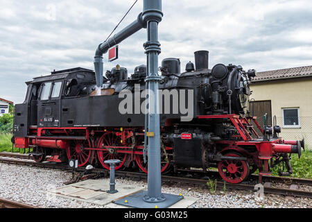 Nostalgia steam engine filling water Stock Photo