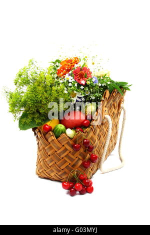 Summer fruits, vegetables and flowers in a basket Stock Photo