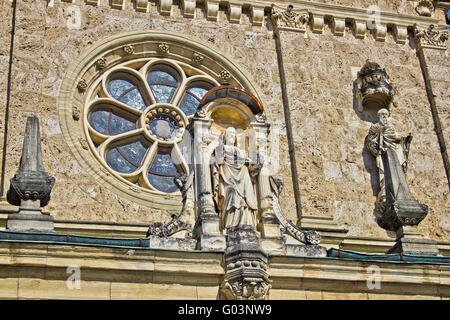 Church architectural detail - window and saint statue Stock Photo
