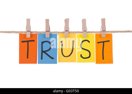 Trust, Colorful words hang on rope by wooden peg Stock Photo