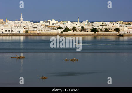 Motor-boats on blue lagoon of the harbour town Sur Stock Photo