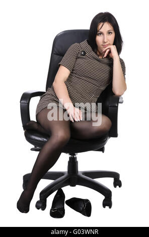 Girl in brown dress in an office chair, isolated Stock Photo