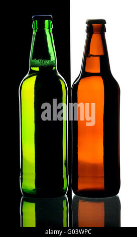 Bottles of beer from green and brown glass, isolated. Stock Photo