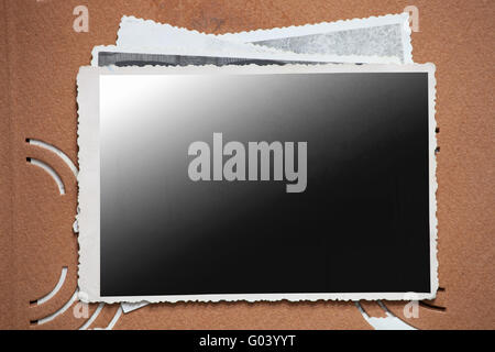 Blank photo frame on a stack of old photos. Stock Photo