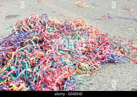 Colorful confetti and streamers at the street after Carnival show Stock ...
