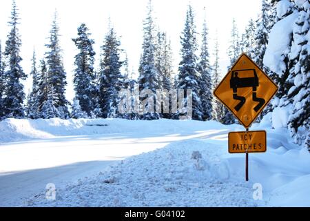 Sign warning of icy patches Stock Photo