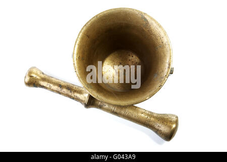 Brass mortar with a pestle isolated on a white Stock Photo