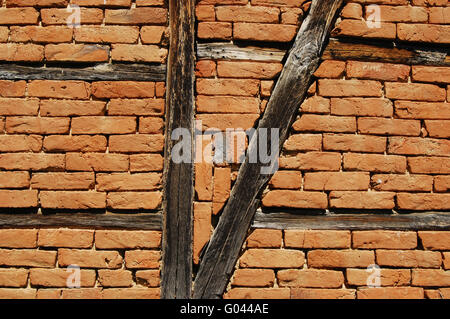Old frame-build half-timbered red bricks barn's wa Stock Photo