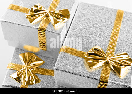 three silver gift boxes with  ribbon it is close up Stock Photo