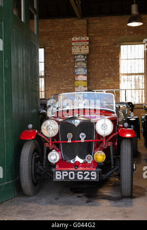Vintage car restoration workshop at Bicester Heritage Centre. Oxfordshire, England Stock Photo