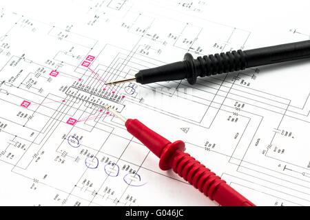 Electricity diagram (drawing or design) and pointed electrical test probes Stock Photo